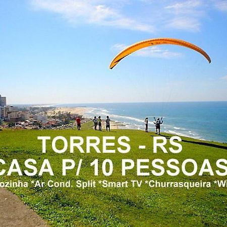 CASA completa em TORRES-RS - O MELHOR CUSTO BENEFICIO na mais bela praia Gaúcha - Cozinha - Banheiro - Ar condicionado - Smart TV 32 Android Apps Youtube - Netflix - Prime Vídeo e Wi-Fi - Estacionamento - Acomoda até 10 pessoas - Anfitriã Superhost n Villa Exterior foto