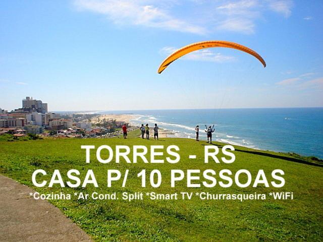 CASA completa em TORRES-RS - O MELHOR CUSTO BENEFICIO na mais bela praia Gaúcha - Cozinha - Banheiro - Ar condicionado - Smart TV 32 Android Apps Youtube - Netflix - Prime Vídeo e Wi-Fi - Estacionamento - Acomoda até 10 pessoas - Anfitriã Superhost n Villa Exterior foto